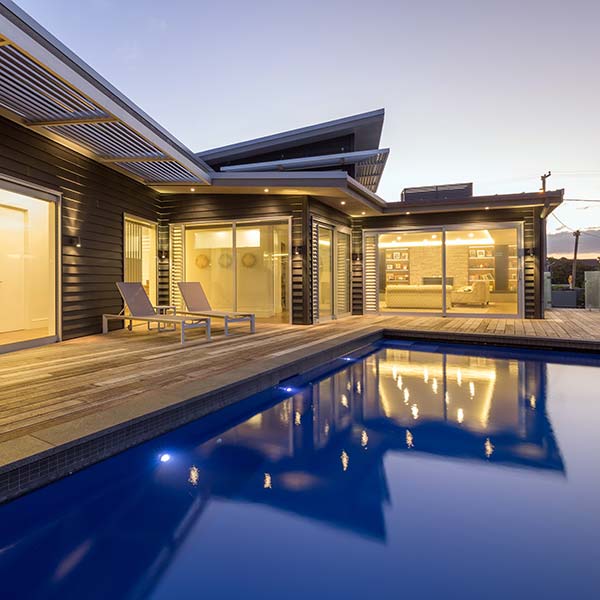 Red Beach House Swimming Pool at Dusk