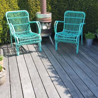 Accoya Color Gray Decking with green chairs far - square