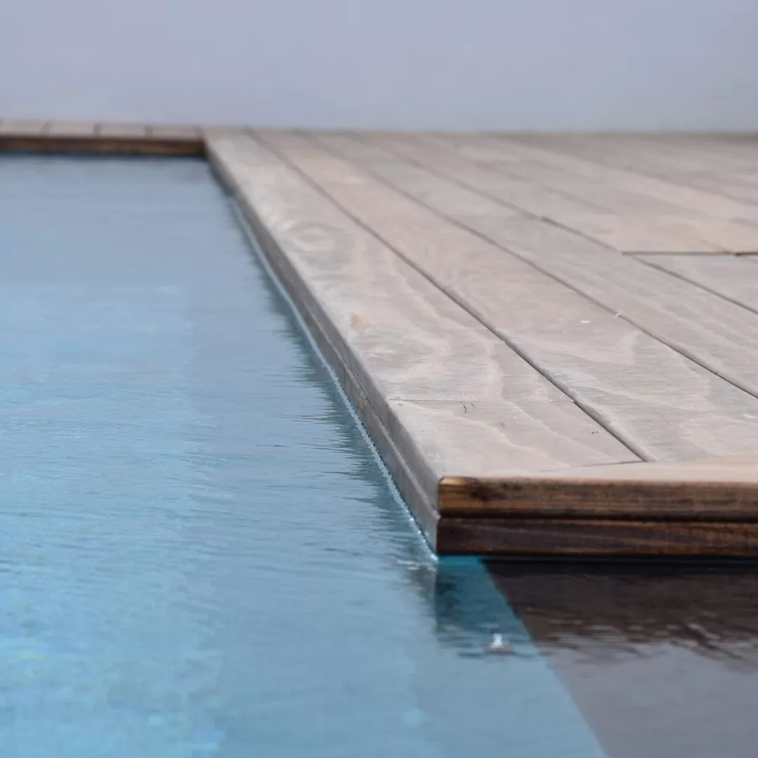 Wood swimming pool deck and pool surround for the perfect garden retreat