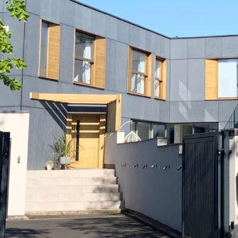 Emmerson home - Accoya front door and canopy with steps far - wide
