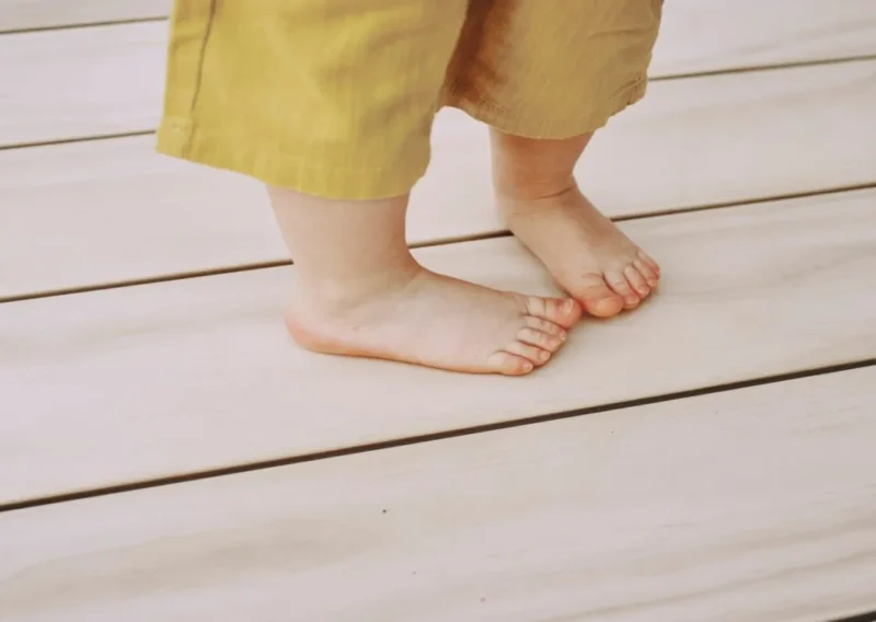 Child demonstrating barefoot-friendly wood decking