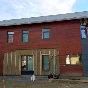 installation of wood siding on duplex