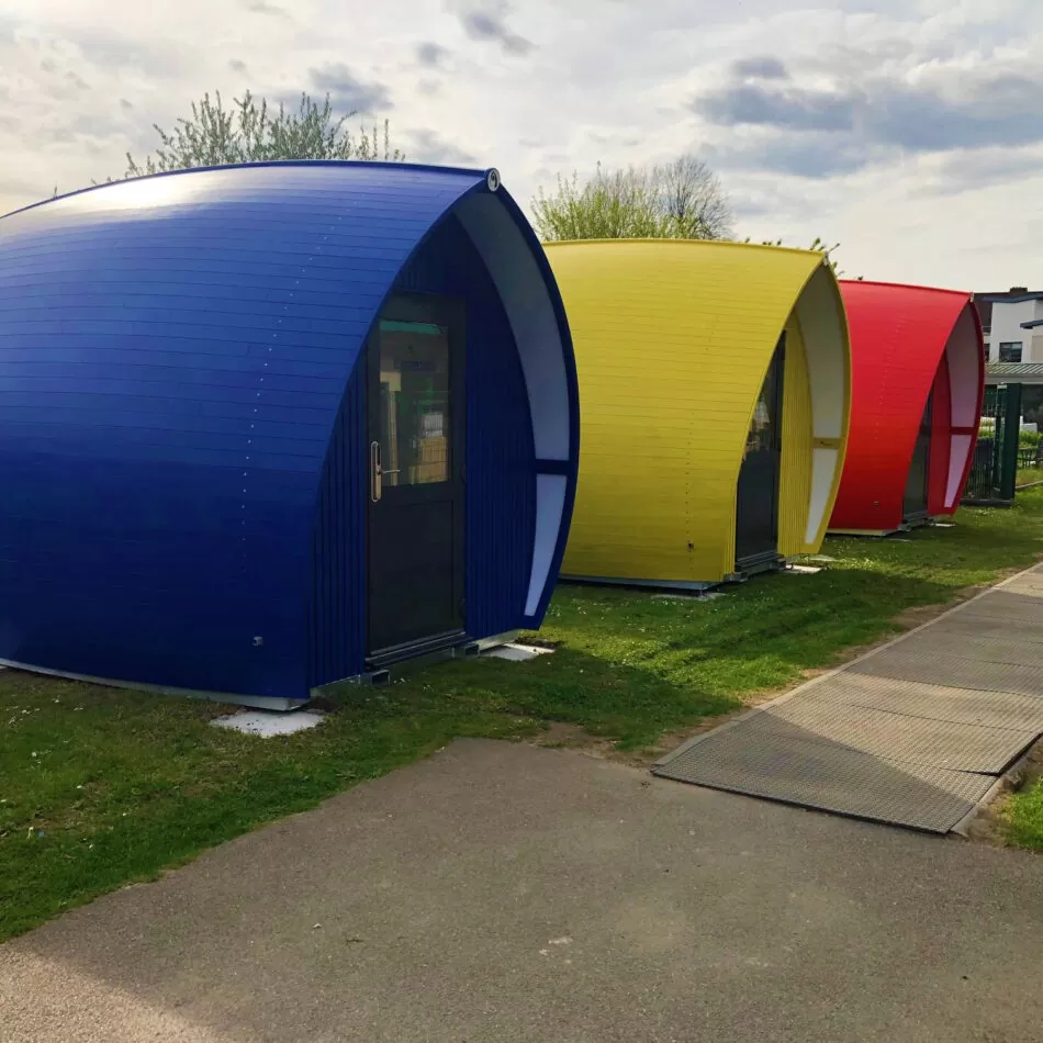 6 colorful pods with Accoya siding 