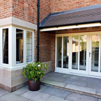 Hardwick casement windows corner bay post square lead painted strutt yellow Melbourne french doors side lights attached top bottom rails brick building