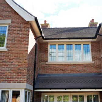 Hardwick casement windows square lead glass painted strutt yellow 5 five panel casement brick building