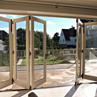 Tutbury bifold door 5 five panel painted strutt yellow clear glass partially open internal view